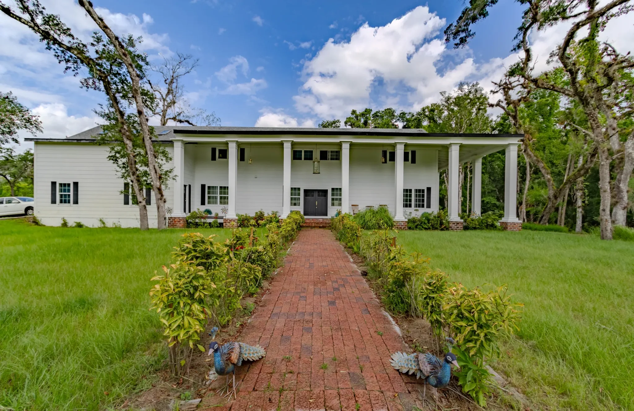 17 Oaks Plantation — completed front facade with grand columns and brick walkway